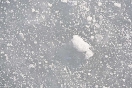 Ice background with snow in winter.