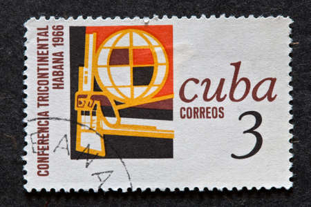 CUBA - CIRCA 1966: A stamp printed in Cuba shows conference in Habana of tree continents, circa 1966.のeditorial素材
