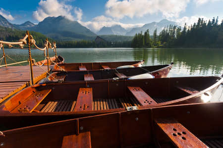 Boats on mountain pond near tatra mountains, Slovakia.の写真素材