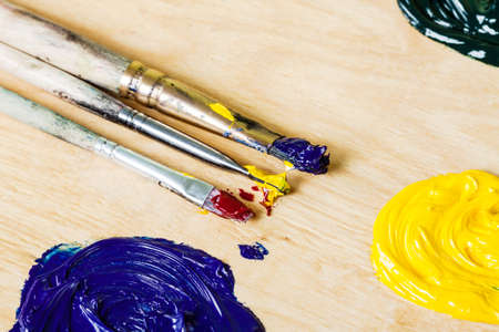 Palette with oil paint and palette knife, macro view.の写真素材