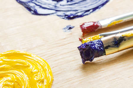 Palette with oil paint and palette knife, macro view.の写真素材