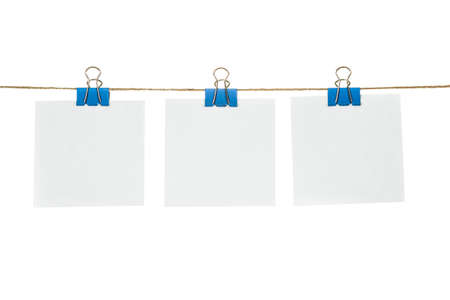 White paper cards hanging on a rope, isolated on a white background.