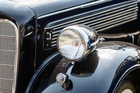 Close-up photo of retro car headlightsの写真素材