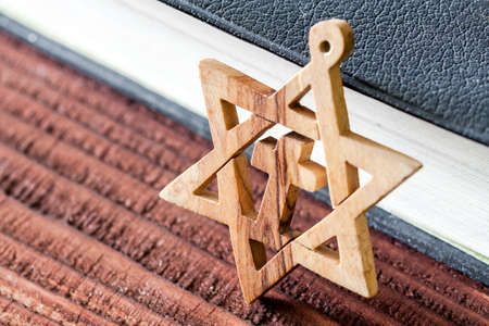 Jewish symbol star of david, on wooden background.の写真素材