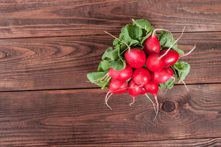 Radishes on rustic wooden backgroundの写真素材