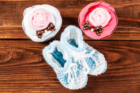 Clothes for the baby on a wooden table