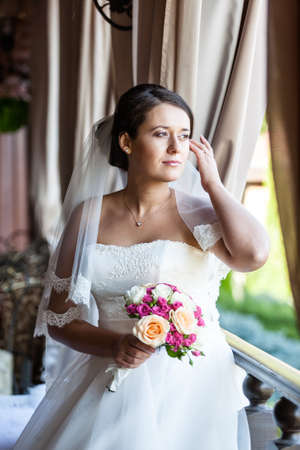Cute bride in luxury interior. Wedding concept.の写真素材