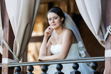 Cute bride in luxury interior. Wedding concept.の写真素材