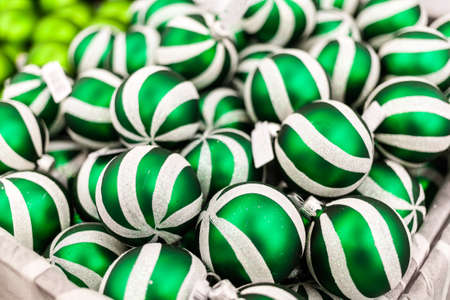Many christmas tree balls in supermarket. Christmas background.