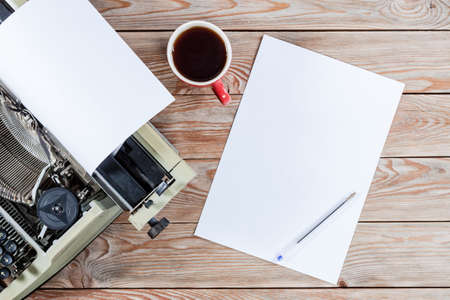 Old vintage antique typewriter machine with paper for text. Writer creation concept.