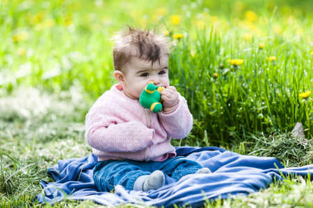 Cute little girl having fun outdoor on nature.の写真素材