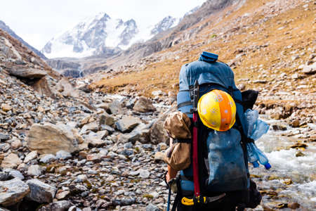 Hiker relaxing at mountains. Tien Shan mountains, central asia, Kyrgyzstan.の写真素材