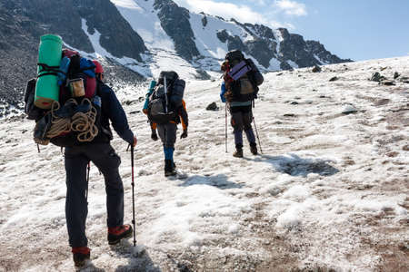 Group of hikers in Tien Shan mountains, central asia, Kyrgyzstan. Climbing and mountaineering concept.の写真素材
