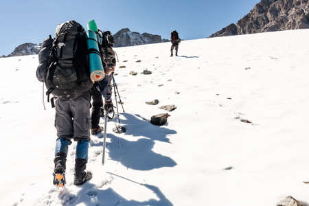 Group of hikers in Tien Shan mountains, central asia, Kyrgyzstan. Climbing and mountaineering concept.の写真素材