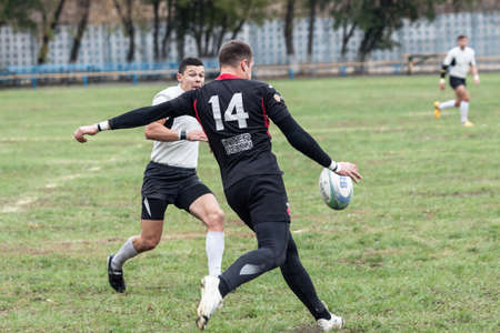 ANTARES - VERES, UKRAINE, KIEV- OCTOBER 16 : Rugby players in action at Ukrainian National Championship rugby match, Antares(in white) vs. Veres(in black), October 16, 2016 in Kiev, Ukraine.のeditorial素材