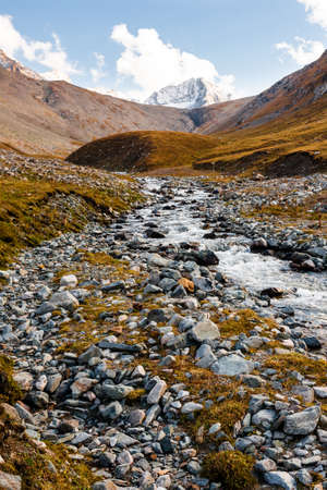 View on mountain peaks with river, Tien Shan, central asia, Kyrgyzstan. Travel concept background.の写真素材