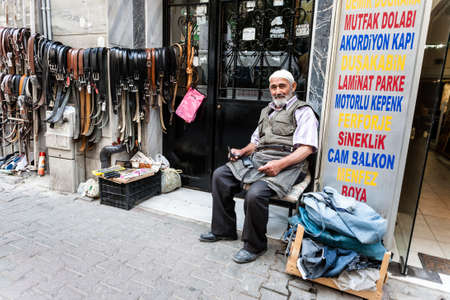 Istanbul, Turkey - September 6, 2011: Unknown old man repairs belts on streets of Istanbul. Handicraft work is very popular in Turkey.のeditorial素材