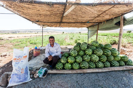 Adana, Turkey - September16, 2011: An unknown farmer selling near the road his grown watermelons.のeditorial素材