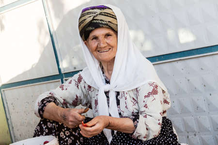 Adiyaman, Turkey - September 17, 2011: An unknown people processed tobacco leaves to create first-class cigarettes and cigars, all workers are Kurdish nationality, and they wear their national clothes.のeditorial素材