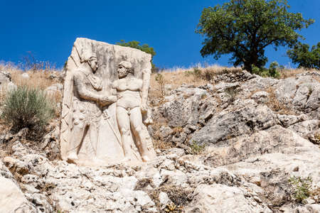 King Mithridates shaking hands with god Herakles, Nemrut National Park, Turkey