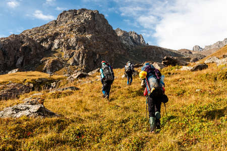 Group of hikers in Tien Shan mountains, central asia, Kyrgyzstan. Climbing and mountaineering...