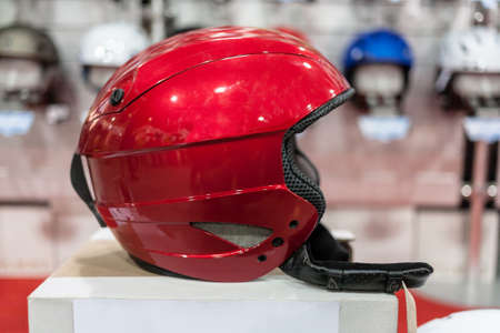 Ski helmet and ski goggles being sold at store. Winter leisure time.の写真素材