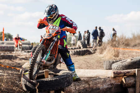 Kiev, Ukraine - October 17, 2016: Motocross riders compete with each other on dirt bikes, during Championship of Ukraine on cross-country final stage.のeditorial素材