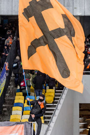 Kiev, Ukraine - December 12, 2016: Ultras of Shakhtar Donetsk in the stands with attributes during the match Ukrainian Premier League game against FC Dynamo Kyiv at NSC Olimpiyskiy Stadium.のeditorial素材