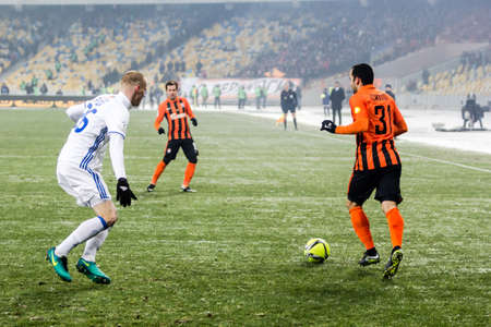 Kiev, Ukraine - December 12, 2016: Mykyta Burda of Dynamo Kyiv fighting for the ball with Ismaili of Shakhtar during Ukrainian Premier League match at NSC Olimpiyskiy stadium.のeditorial素材