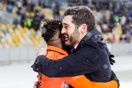 Kiev, Ukraine - December 12, 2016: Paulo Fonseca, head coach of Shakhtar Donetsk giving a hug to Fred during Ukrainian Premier League match against Dynamo at NSC Olimpiyskiy stadium.のeditorial素材