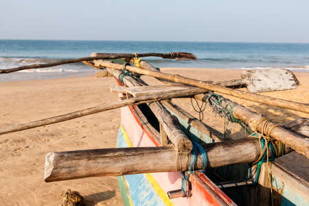Traditional fishing boat on beach at sunrise, Sri Lanka, Asia.の写真素材