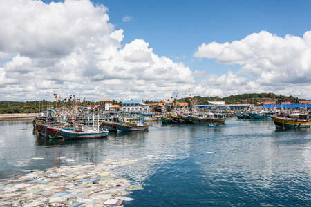 The large fisheries harbor, full of boats and trawlers Sri Lanka, Asia.の写真素材