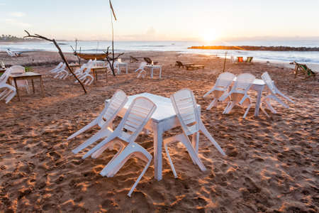 Chairs with tables on tropical beach in Sri Lanka, Asia.の写真素材