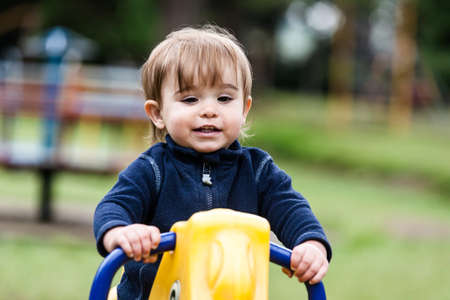 Active little girl having fun on a children playground.