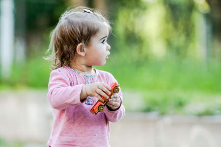 Active little girl having fun on a children playground.の写真素材