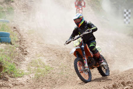 Kiev, Ukraine - July 16, 2017: Motocross riders compete with each other on dirt bikes, during Championship of Ukraine on cross-country final stage.のeditorial素材