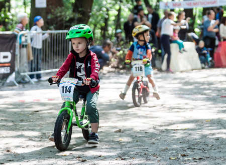 Kiev, Ukraine â September 9, 2017: Unknown young biker, at the child amateur bicycle competition Â«We are the championsÂ».のeditorial素材