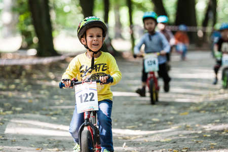 Kiev, Ukraine â September 9, 2017: Unknown young biker, at the child amateur bicycle competition Â«We are the championsÂ».のeditorial素材