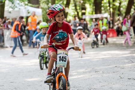 Kiev, Ukraine â September 9, 2017: Unknown young biker, at the child amateur bicycle competition Â«We are the championsÂ».のeditorial素材