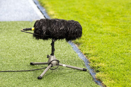 Furry sport microphone on a soccer fieldの写真素材