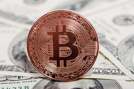 Bitcoin coin on dollars. New virtual money. Mining of crypto-currencies. Business and Trading...