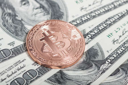Bitcoin coin on dollars. New virtual money. Mining of crypto-currencies. Business and Trading...