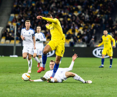Kyiv, Ukraine - March 14, 2019: Ruben Loftus-Cheek of Chelsea fighting for the ball with Tomasz Kedziora of Dynamo Kyiv during UEFA Europa League match at NSC Olimpiyskiy stadium.のeditorial素材