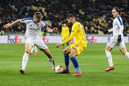 Kyiv, Ukraine - March 14, 2019: Ruben Loftus-Cheek of Chelsea fighting for the ball with Serhiy Sydorchuk of Dynamo Kyiv during UEFA Europa League match at NSC Olimpiyskiy stadium.のeditorial素材