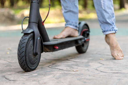 Electric scooter, close view on the wheel. Eco friendly transport, electric scooter city transport.