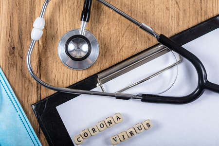 Coronavirus covid-19 objects concept. Text with respirator. Health care and medicine concept.の写真素材