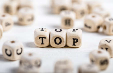 Word TOP formed by wood alphabet blocks. On old wooden table.の写真素材