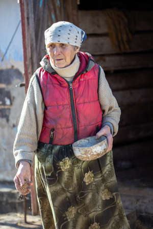 KORETS, UKRAINE - March 14, 2022: Humanitarian catastrophe in Ukraine. War between Ukraine and Russia. Old people in villages of Ukraine.のeditorial素材