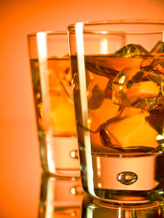 Two glasses of whiskey on the rocksの写真素材