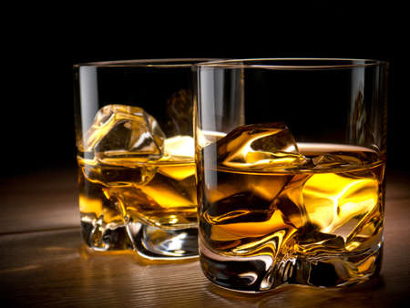 Two glasses of whiskey on the rocksの写真素材